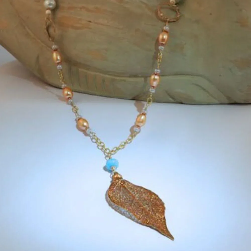 Hand made gold necklace with‎ gold and blue fresh water pearls